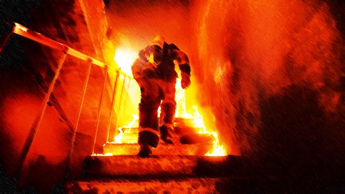 firefighter running up flaming stairs - California has special, favorable workers' compensation rules for firefighters