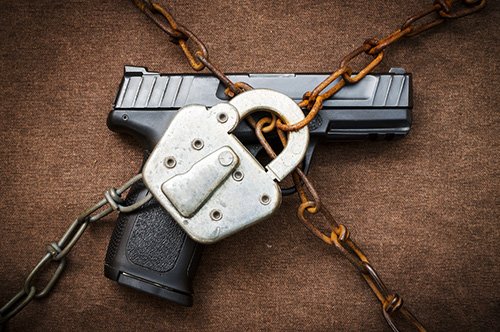 gun with a chain and a padlock