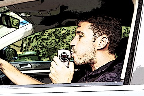 man blowing into an ignition interlock device - motorists must install these after certain Colorado DUI convictions