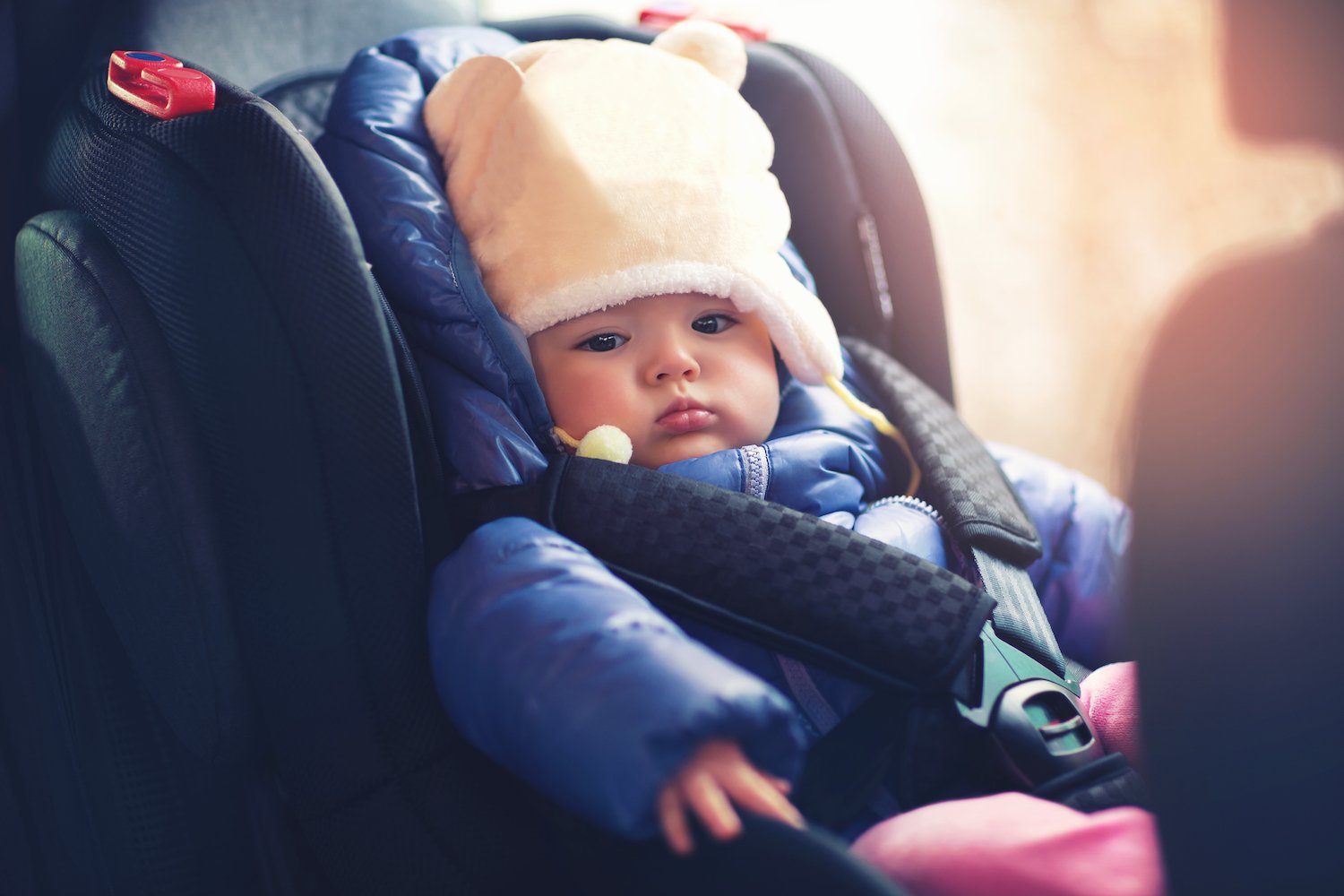 Infant in car seat in compliance with Nevada law.