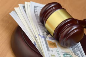 Gavel with cash