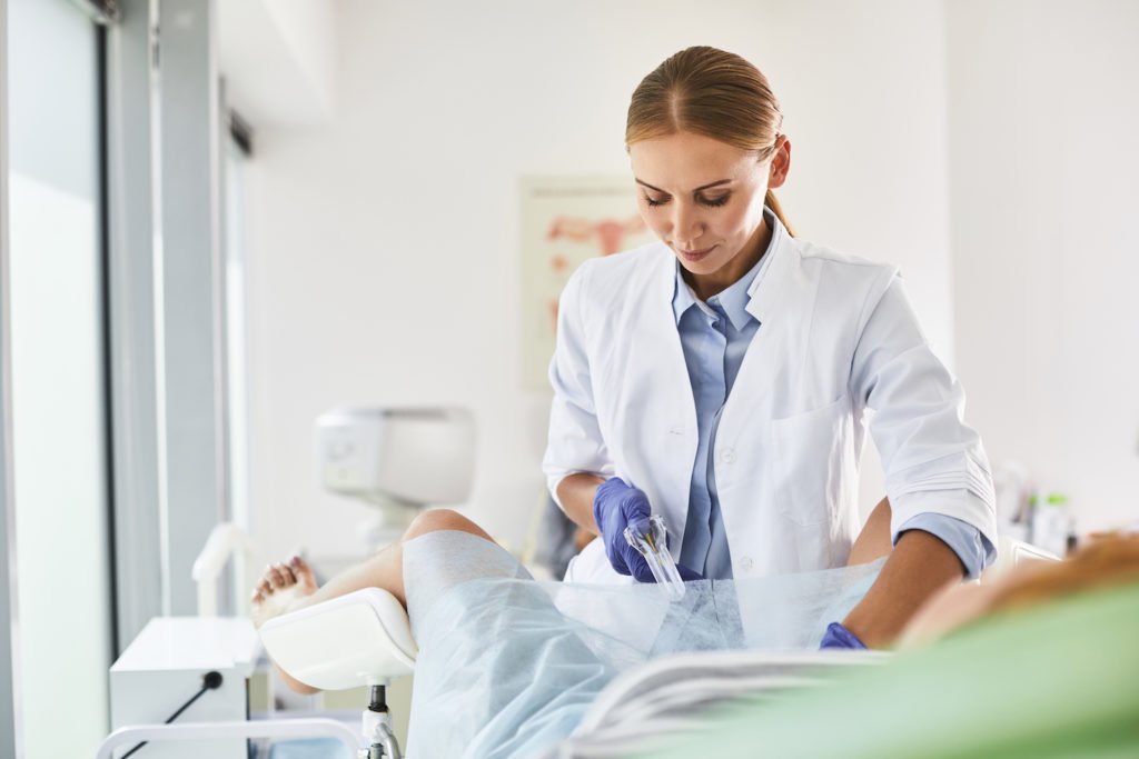 Doctor about to remove a Paragard IUD>
