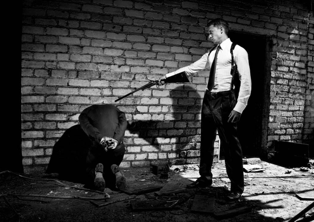 Recreation of a ganster killing, which violates federal RICO laws.