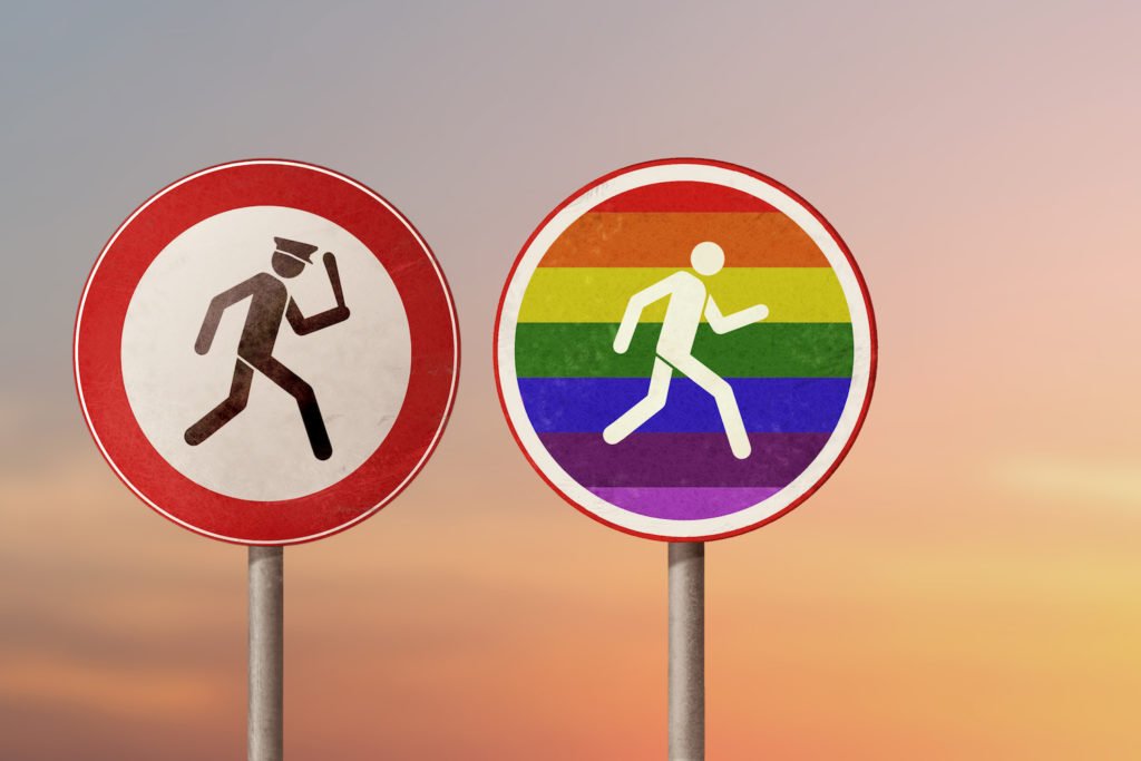 Sign of police chasing a LGBT person