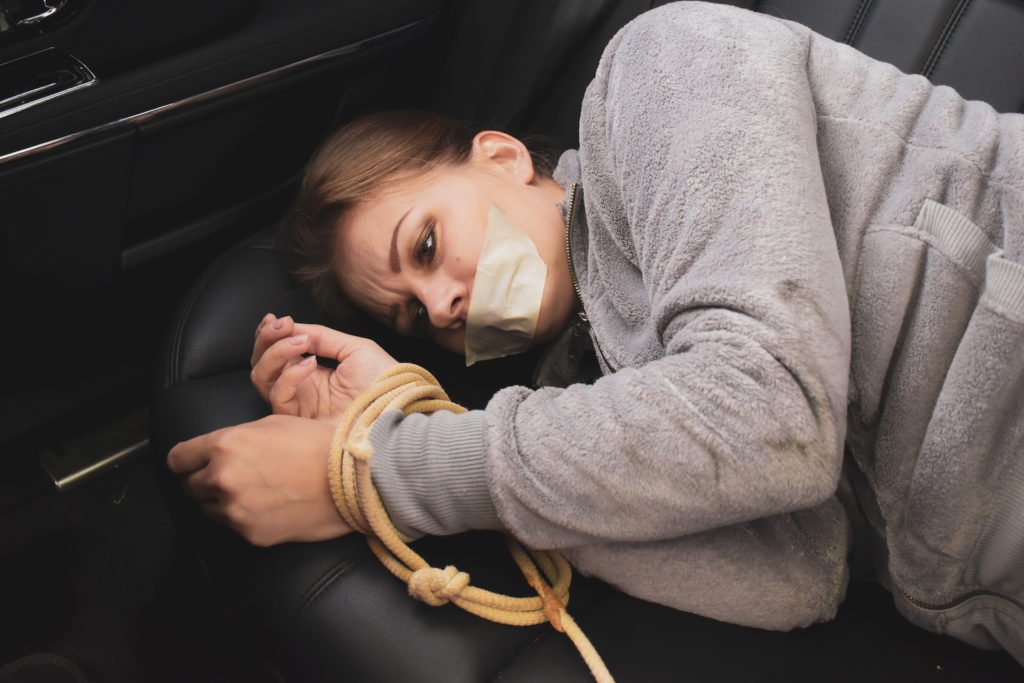 Kidnapping and carjacking victim bound and gagged in backseat of car