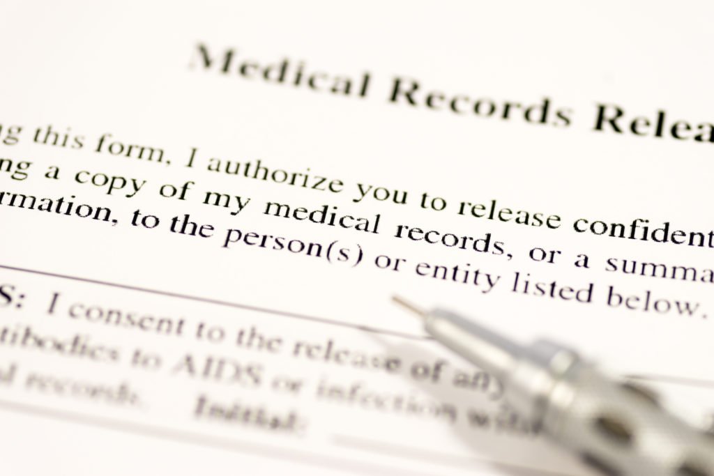 Paper that says "medical records release" with a pen - one of the forms in a California workers' compensation case