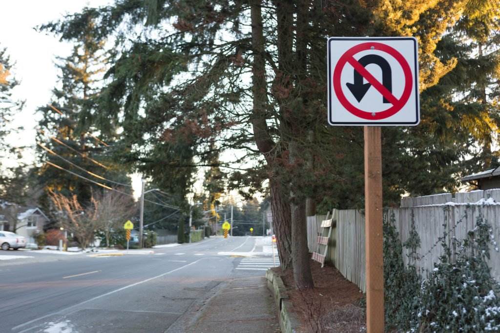 No U-turn sign on residential street