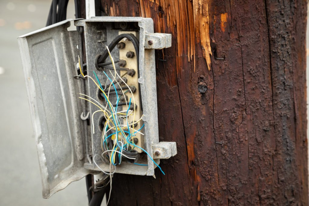 An electrical cabinet that was vandalized by having its wires cut