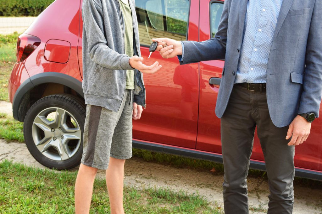 Parent handing keys to teen who has no license to drive in violation of CRS 42-2-140