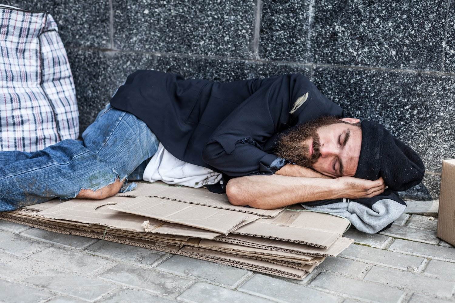 Homeless man violating the new Las Vegas encampment ordinance.