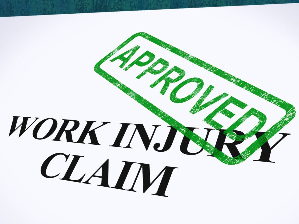 Paper that says "work injury claim" with a green "approved" stamp
