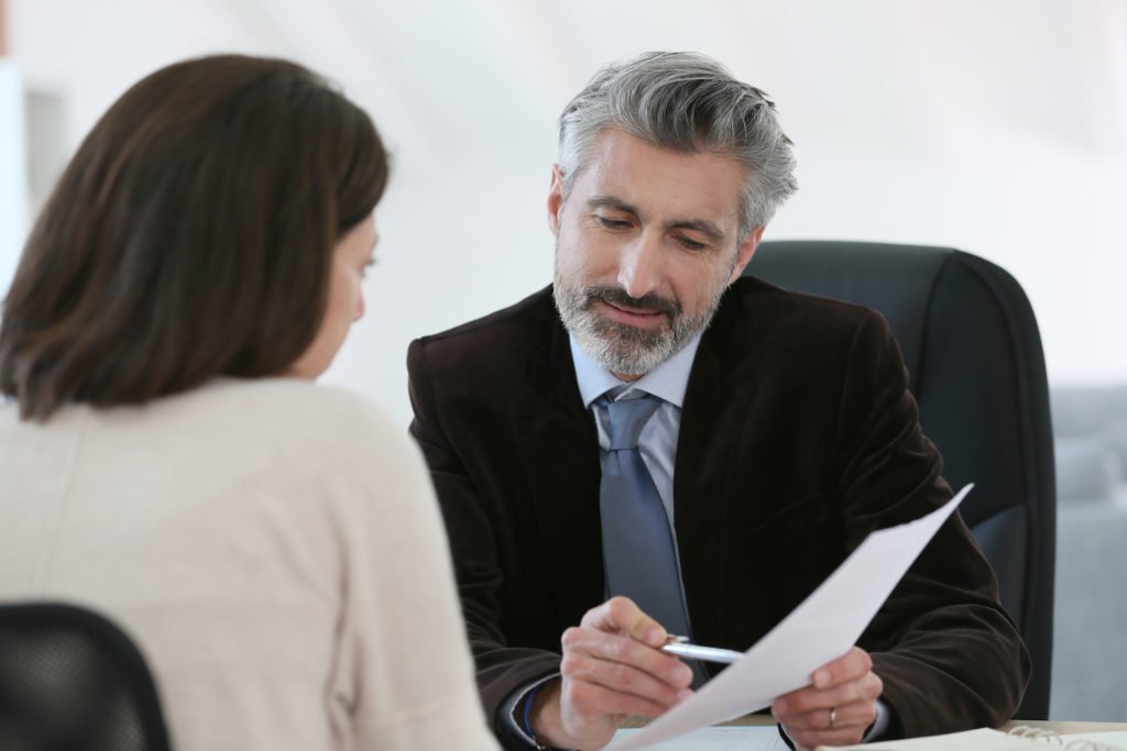 Attorney meeting with a client in an office
