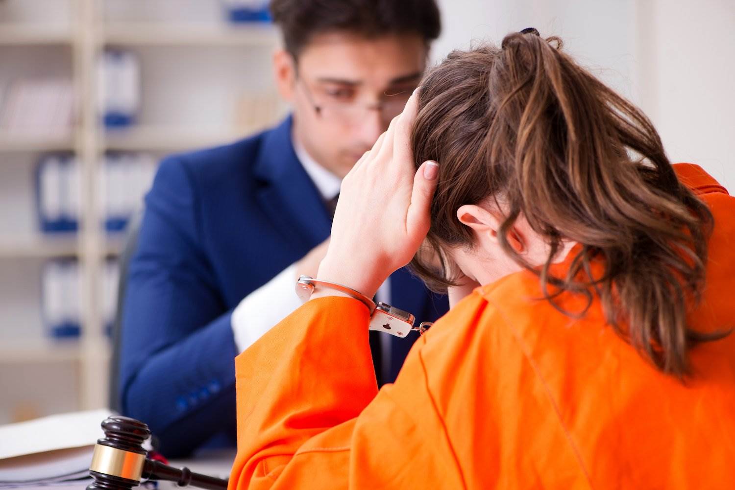 Attorney speaking with female inmate