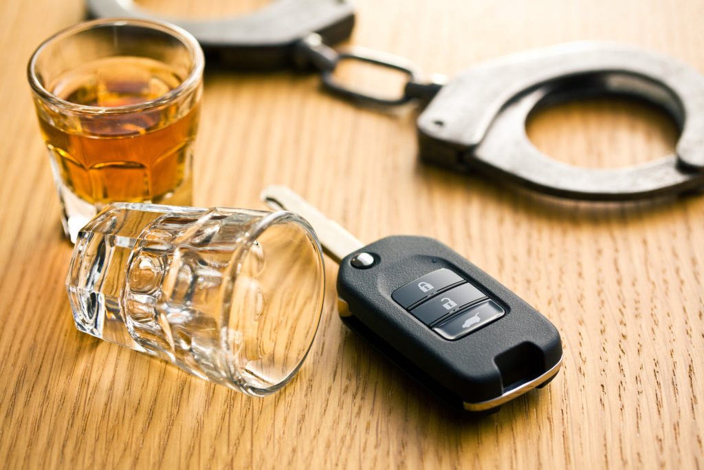 Shot glasses, car keys, and handcuffs