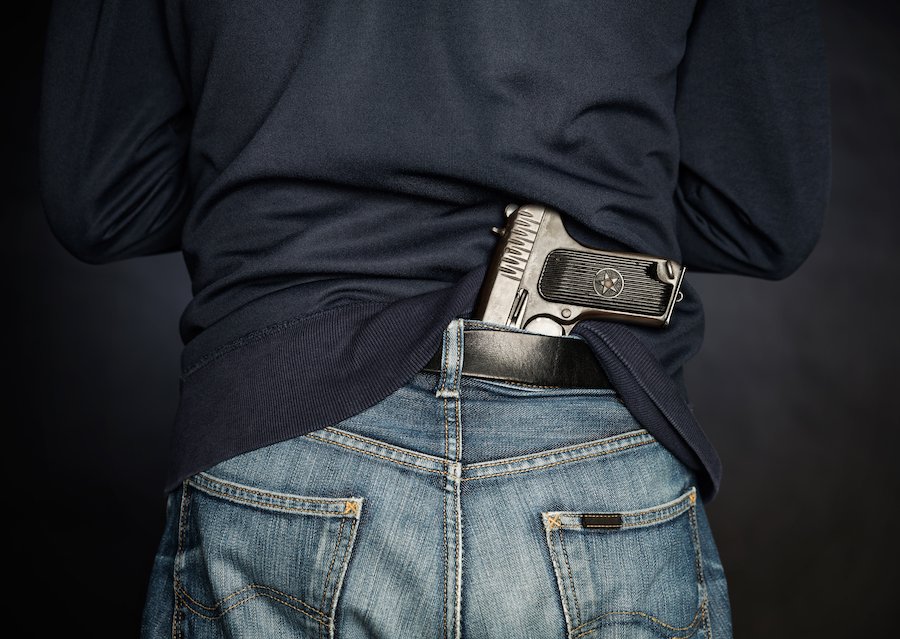 Felon with gun tucked in jeans