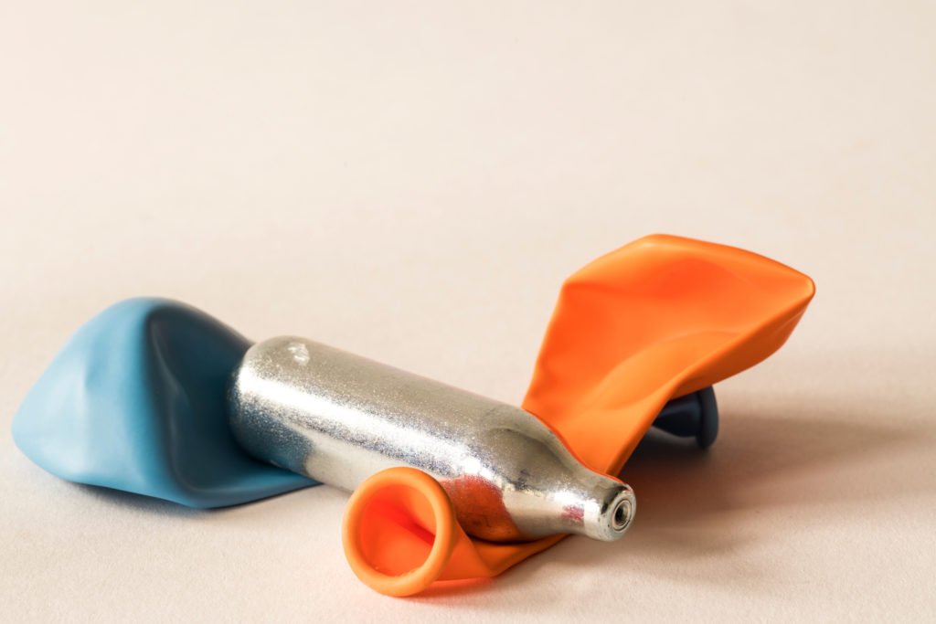 Laughing gas canister with two balloons
