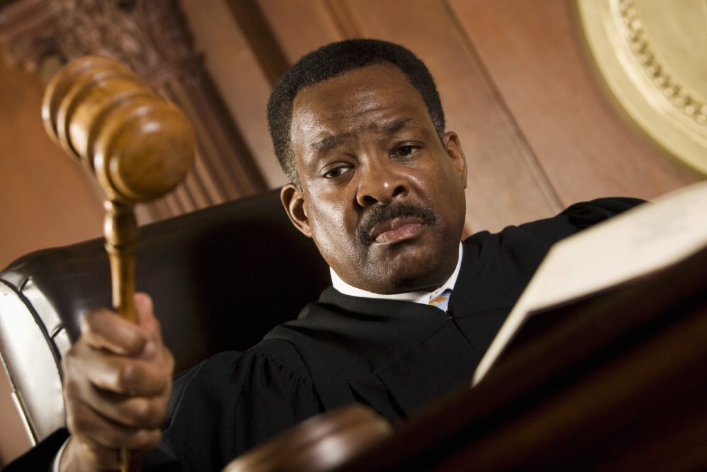 Judge hammering gavel on desk