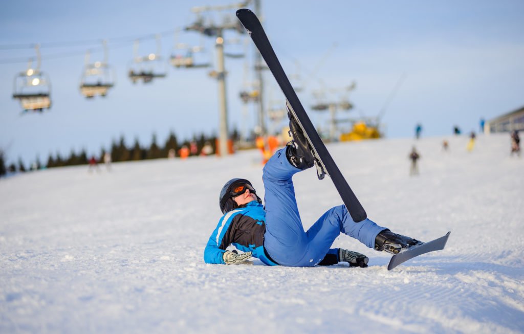 Skier who fell against backdrop of ski lift