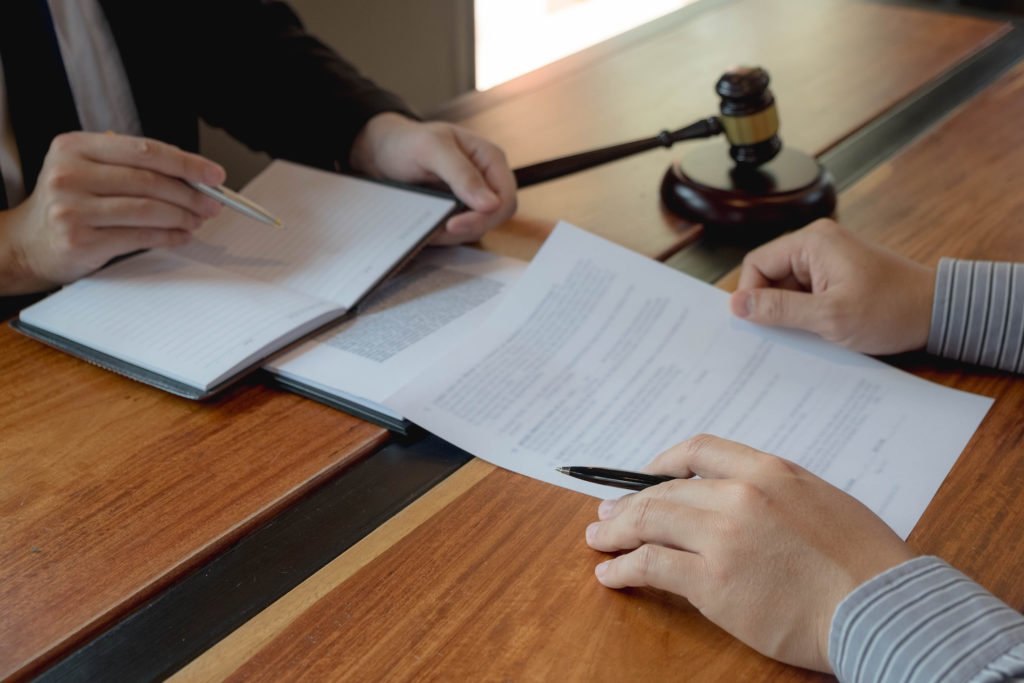 Judge giving diversion defendant a contract to sign