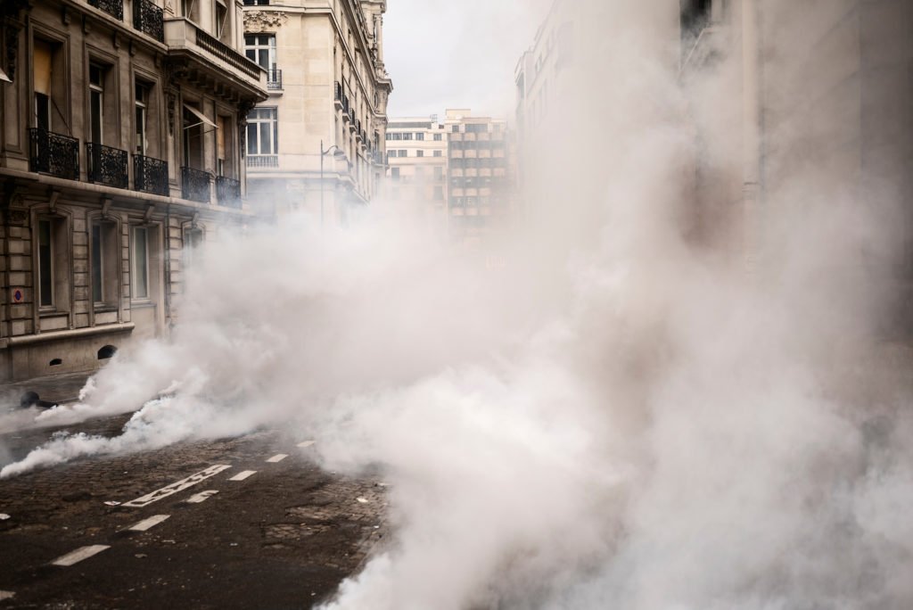 Abandoned riot after police used tear gas, which does not violate CRS 18-4-513. 