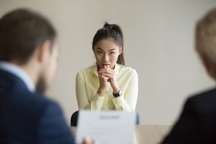 Woman in meeting with public servants about to commit perjury