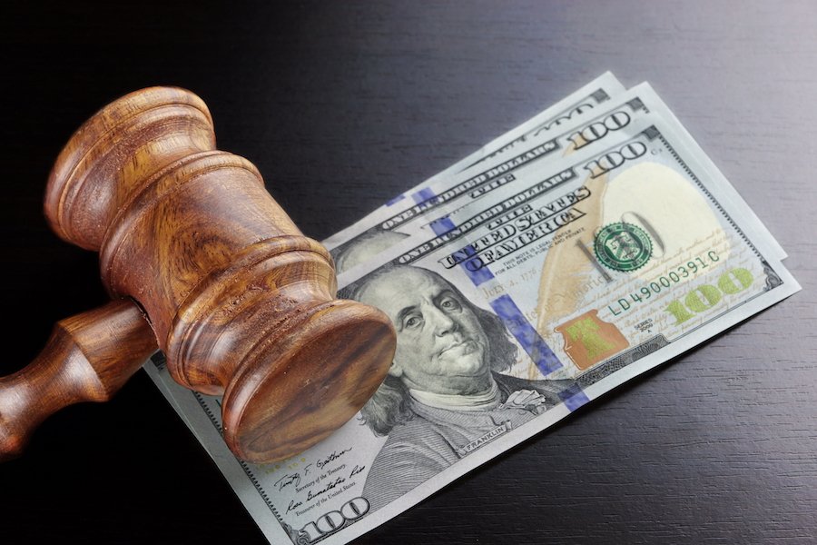 Gavel on top of stack of $100 bills