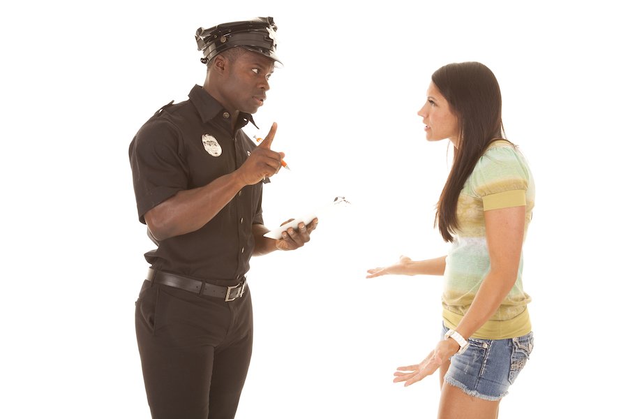 Policeman detaining female suspect