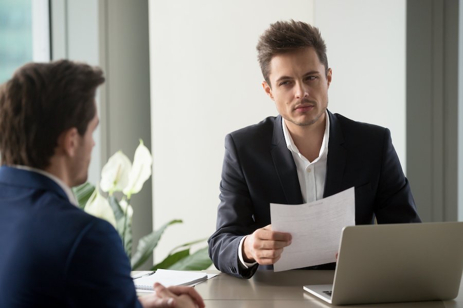 CDLE employee looking suspiciously at UI claimant
