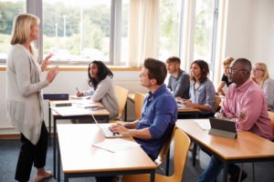 DUI School classroom with teachers and students at desks