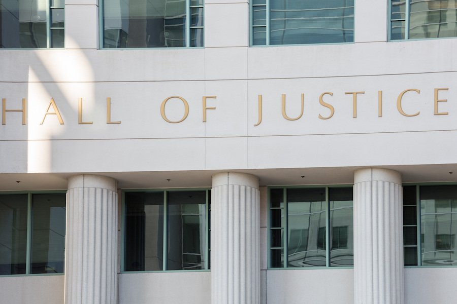 California courthouse exterior with "hall of justice" lettering