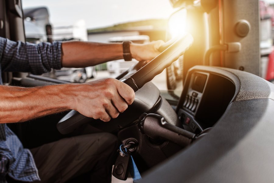 Drunk driver holding truck steering while