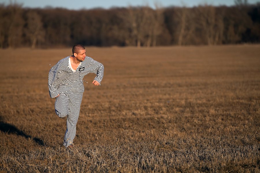 Prisoner in striped uniform violating CRS 18-8-208.1.