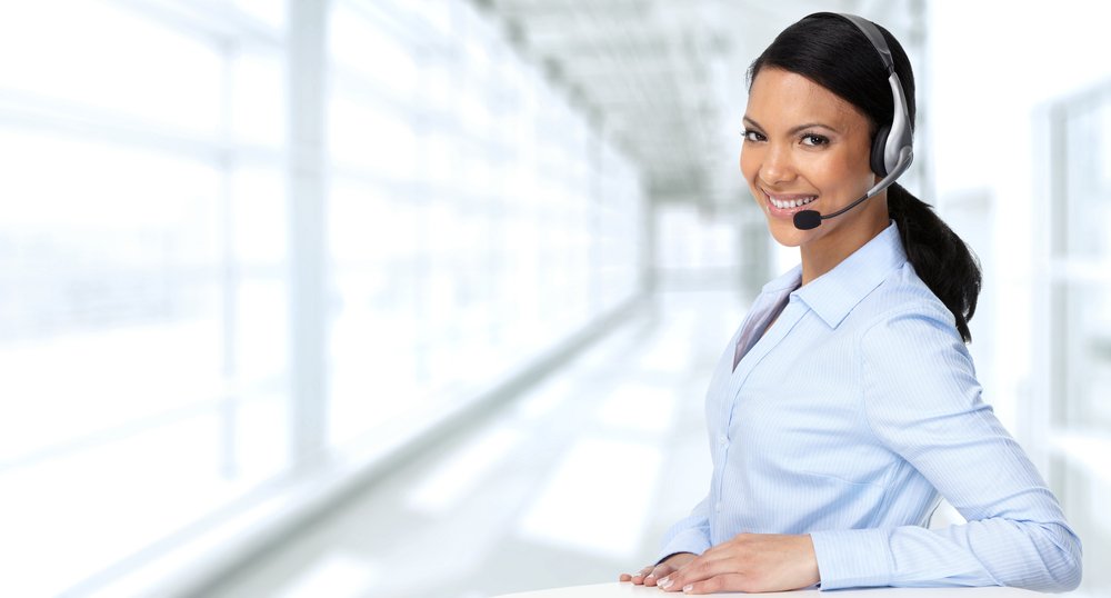 receptionist smiling with headset on