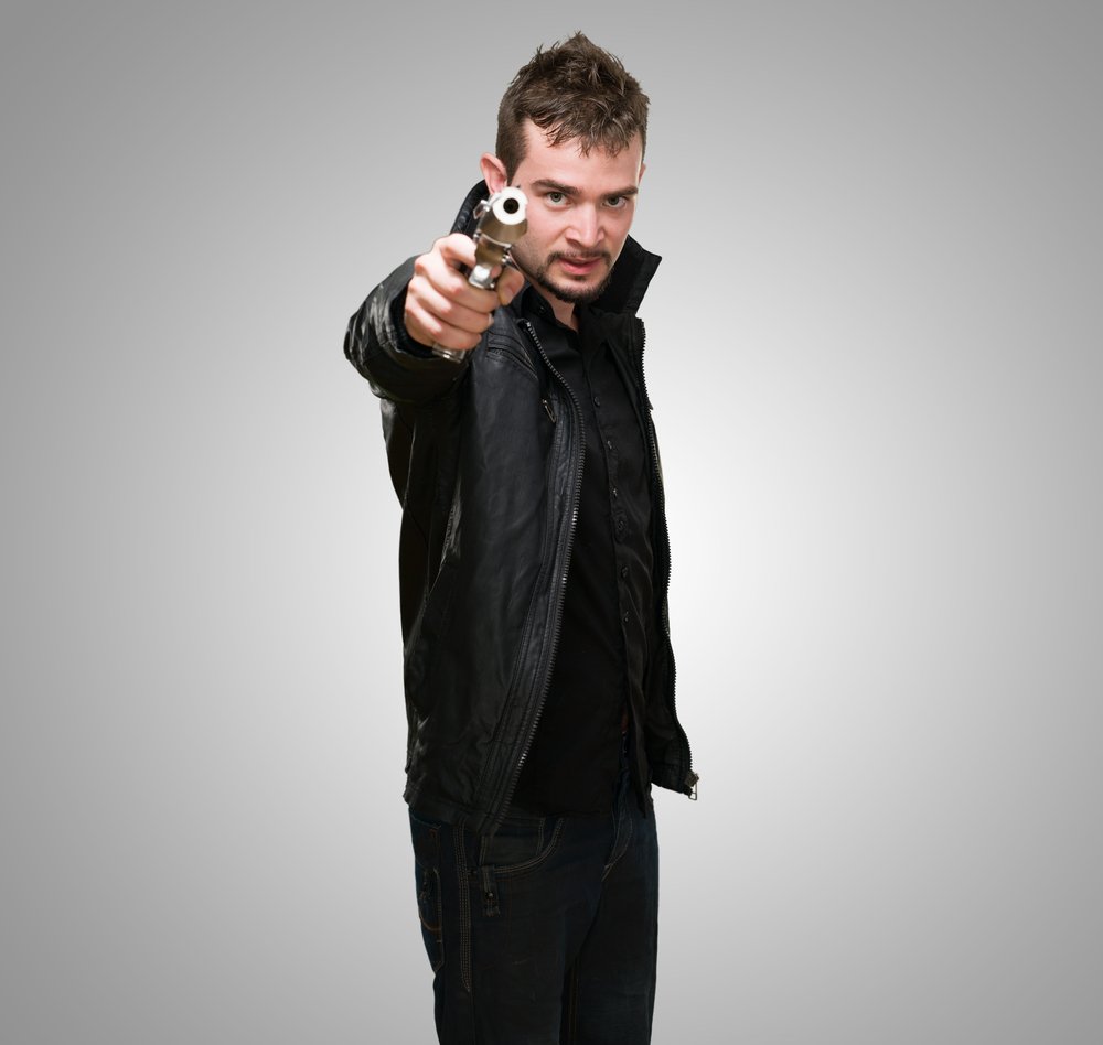 man pointing gun in viewer's direction