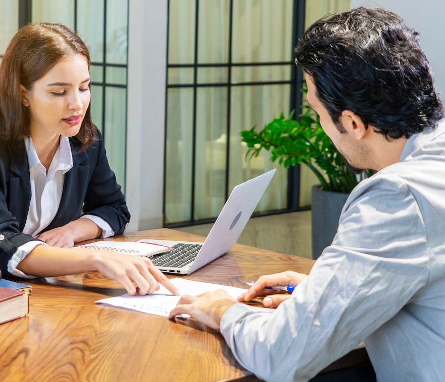 A Las Vegas domestic violence lawyer counseling a client in a law office