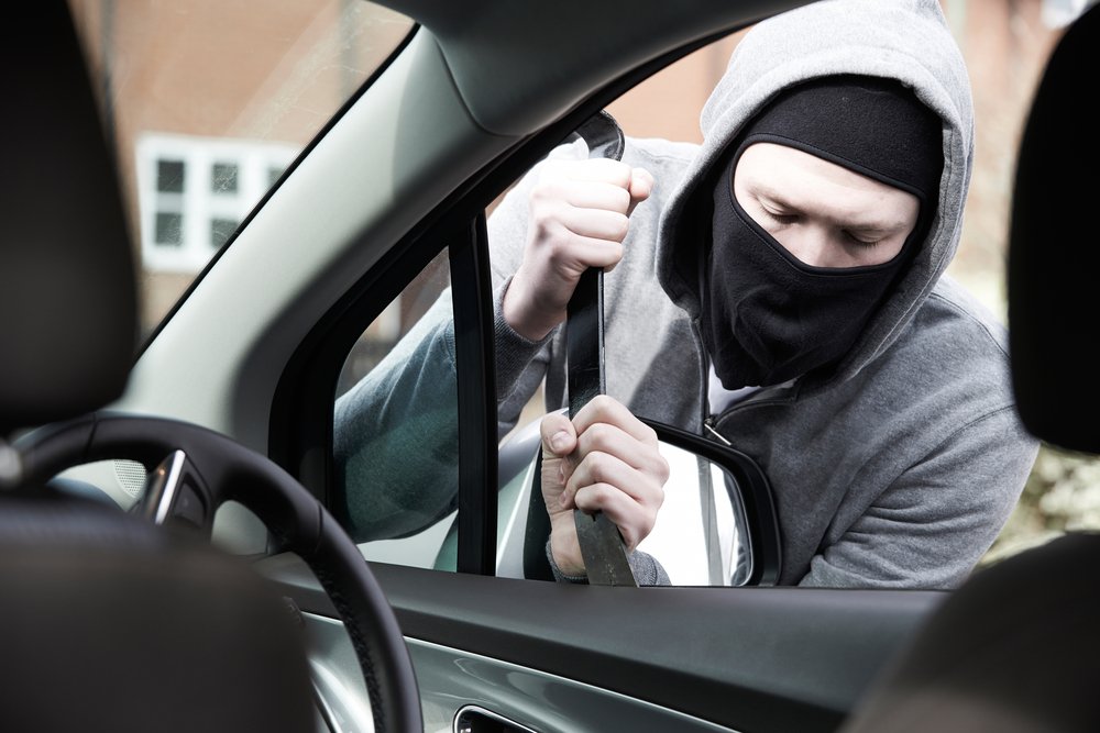would-be car thief damaging vehicle