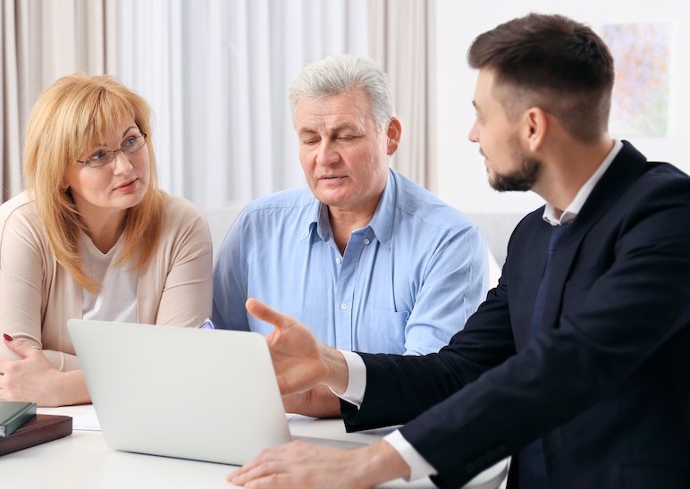 Attorney discussing payment plans with two casino marker clients