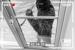 burglar illegally entering a house