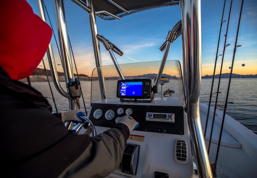 Boater driving boat on Lake Mead