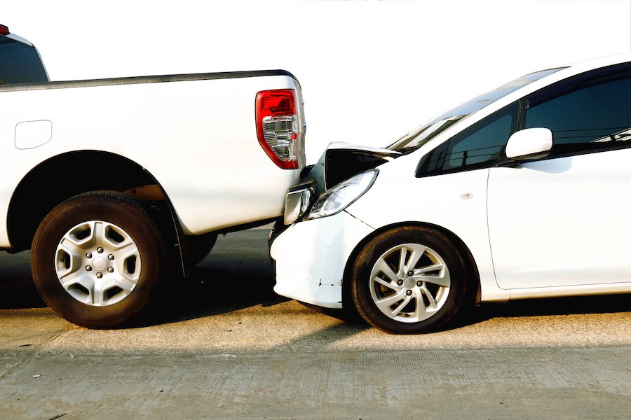 aftermath of rear-end car accident between sedan and pickup truck