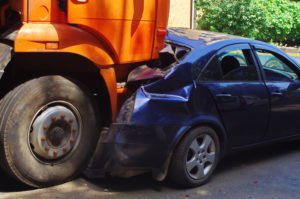 Aftermath of truck rear-ending a sedan