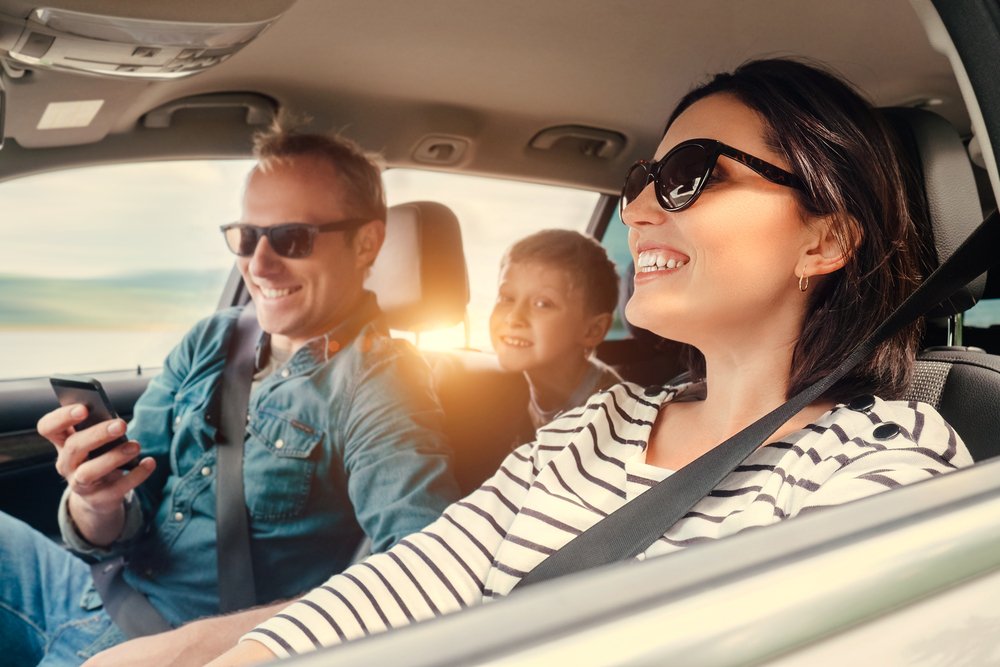Parents and child in a car