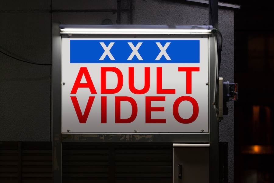 Sign of adult video store, which contains material "harmful to minors"