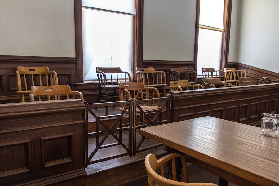 Jury Box And Defendant Table. Small rural county courthouse interior with juror box and table for defendant.