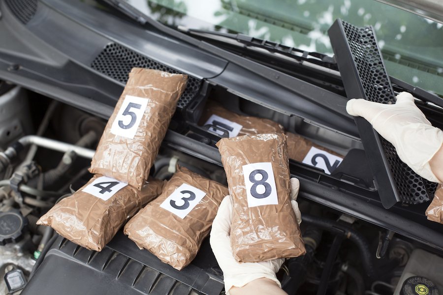 Packages of marijuana being handled by police