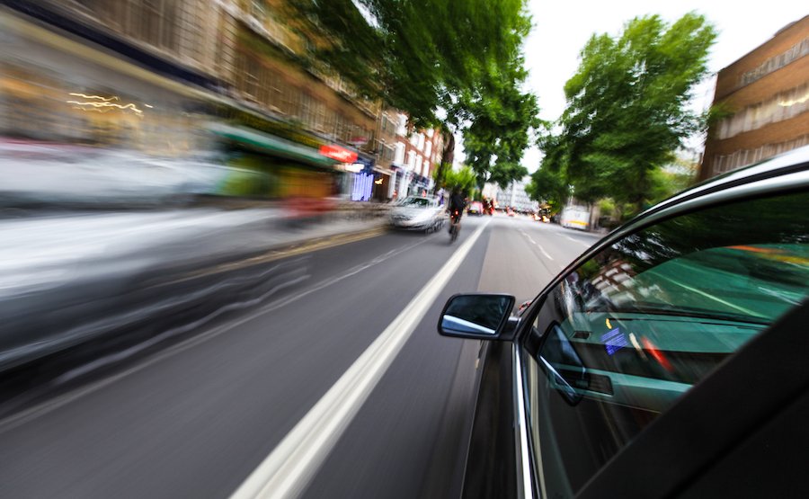 Car speeding through city street