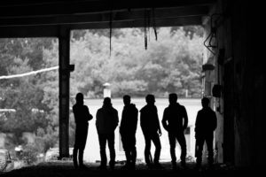 Silhouette of six gang members
