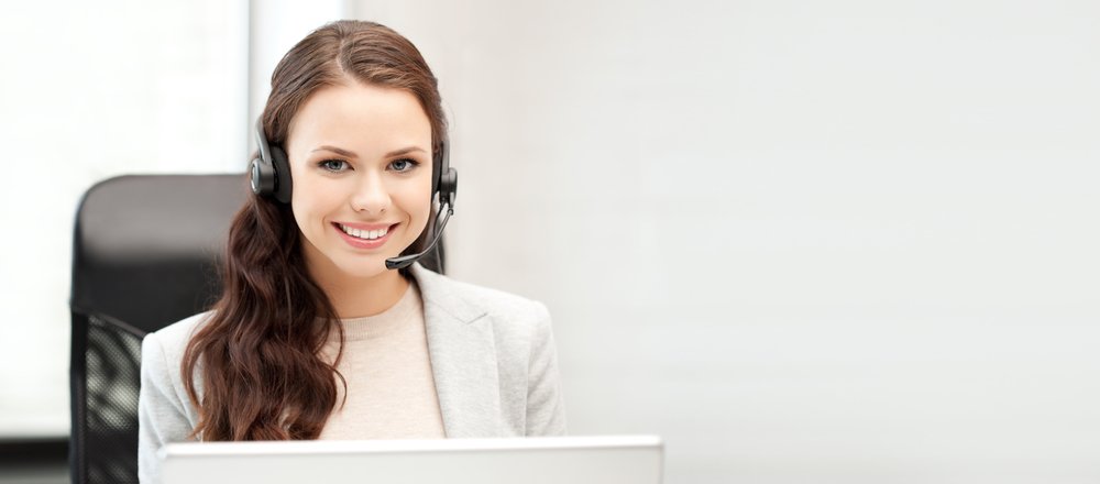 Receptionist smiling with headset on