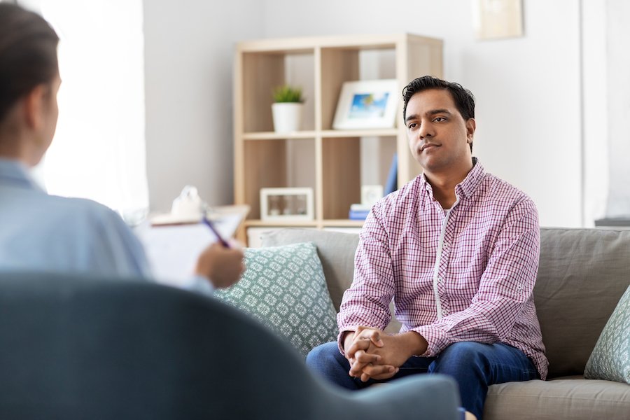 Man on couch in therapy session