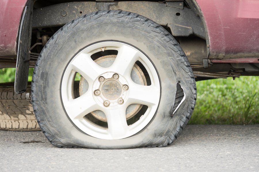 Flat tire on the side of the road 